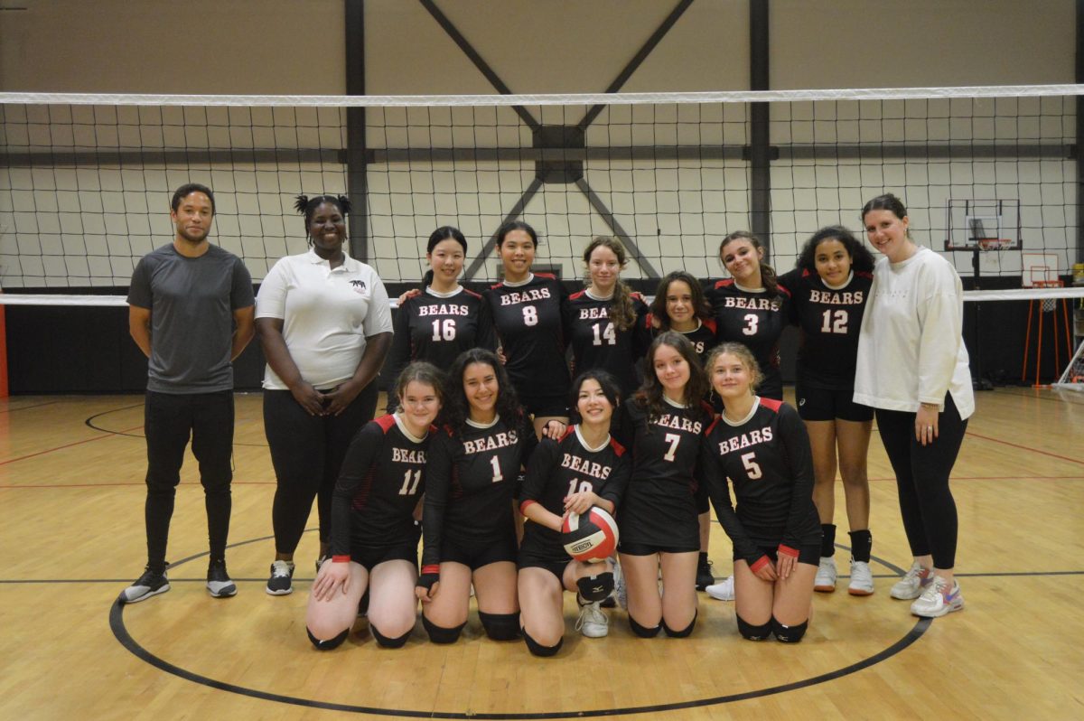 2024 BASIS Independent Brooklyn Varsity Volleyball team with Coach Nalipinski, Assistant Coach Johnson, and Athletic Director McCollum